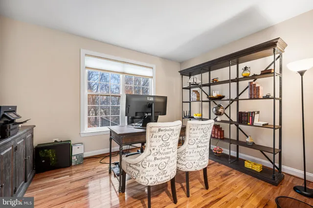 a view of a deck with couches chairs with wooden floor and fence