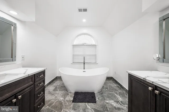 a picture of a bathroom with a shower