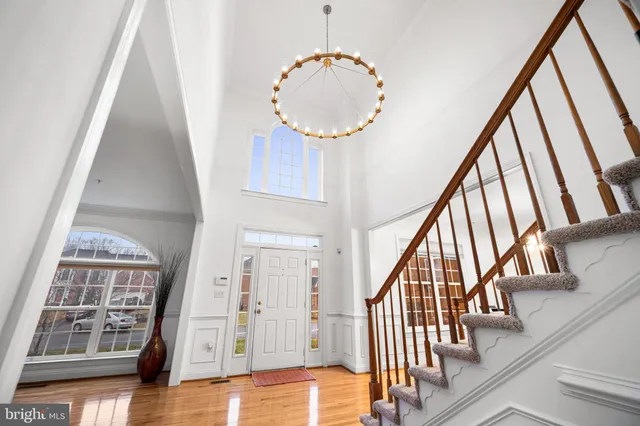 a living room with furniture and view of kitchen