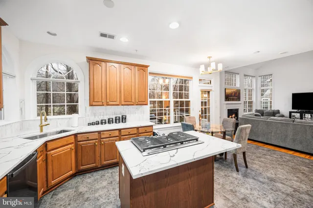 a view of kitchen with wooden floor and electronic appliances