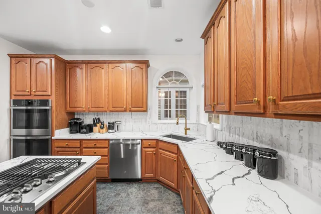 a bathroom with a sink vanity and a mirror
