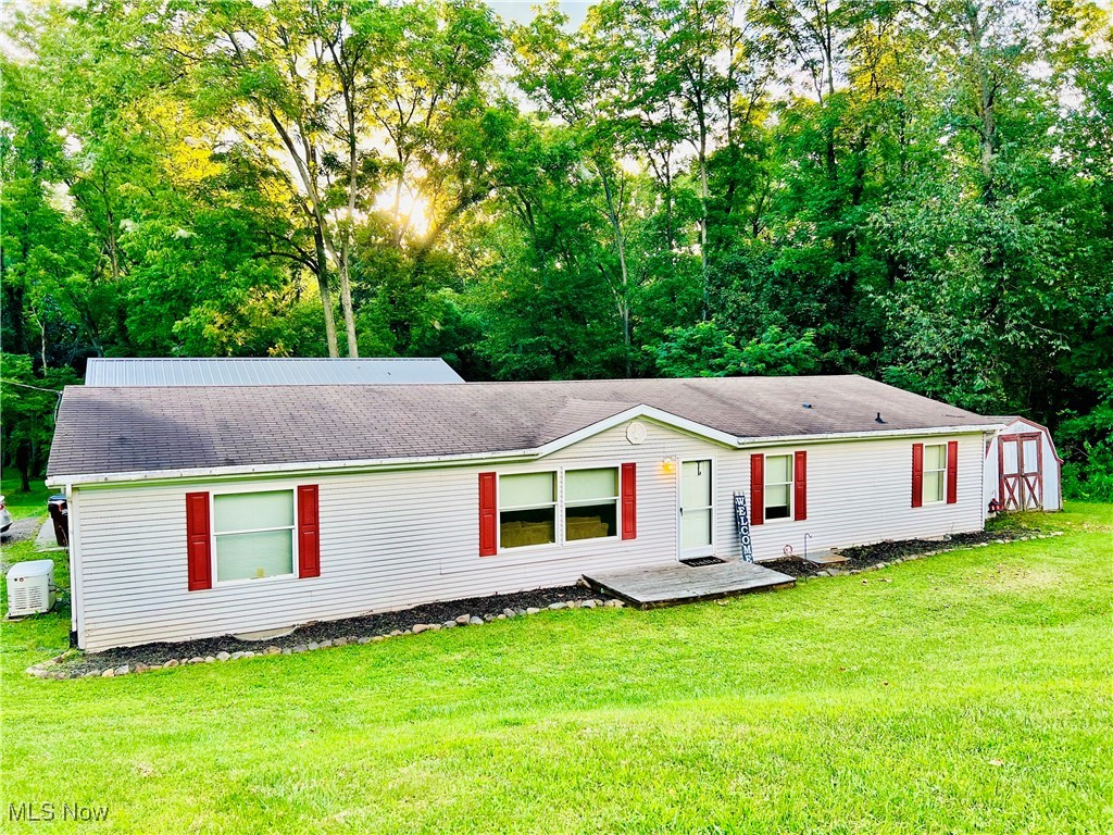 8081 Big Run Road Gambier, OH 43022 - Photo 1 of 28 View of front of home featuring a front lawn and a storage unit
