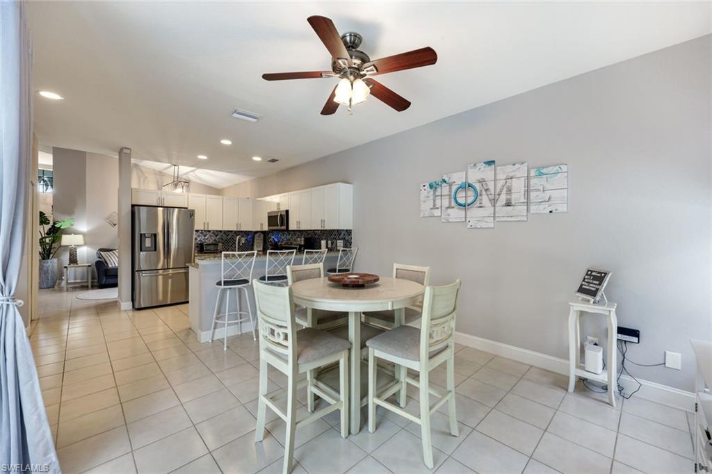 697 Crossfield Circle Naples, FL 34104 - Photo 10 of 18 Dining room featuring light tile patterned floors, ceiling fan, and recessed lighting