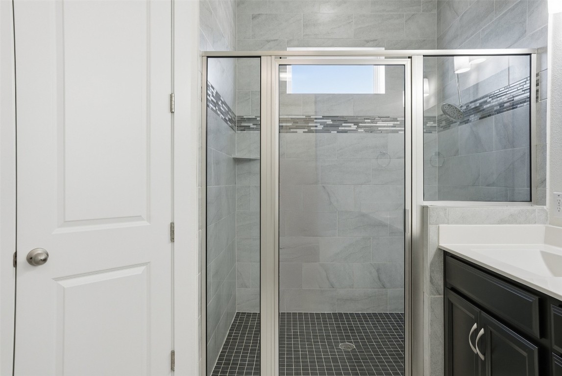 12604 Red Sparrow Street, Unit 14 Austin, TX 78729 - Photo 14 of 40 Full bath with vanity and a stall shower