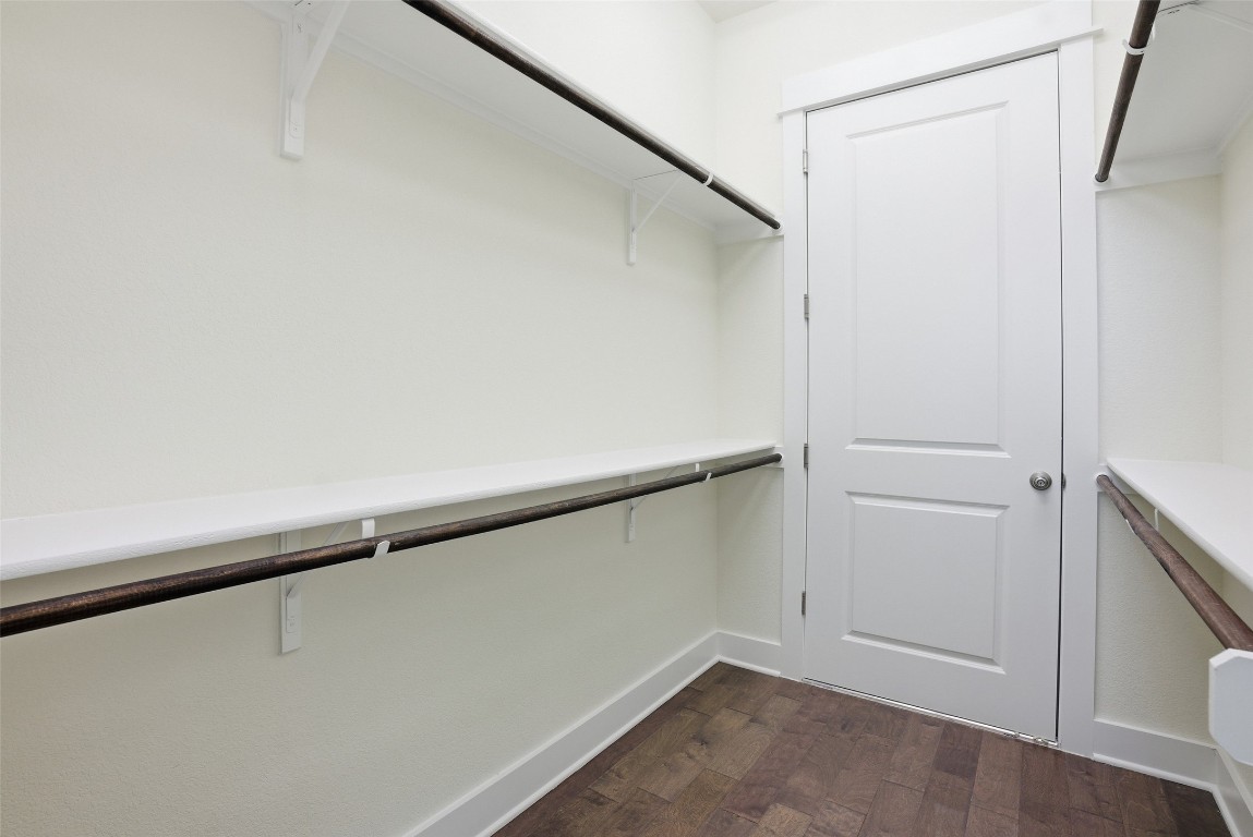 12604 Red Sparrow Street, Unit 14 Austin, TX 78729 - Photo 15 of 40 Spacious closet with dark wood-type flooring