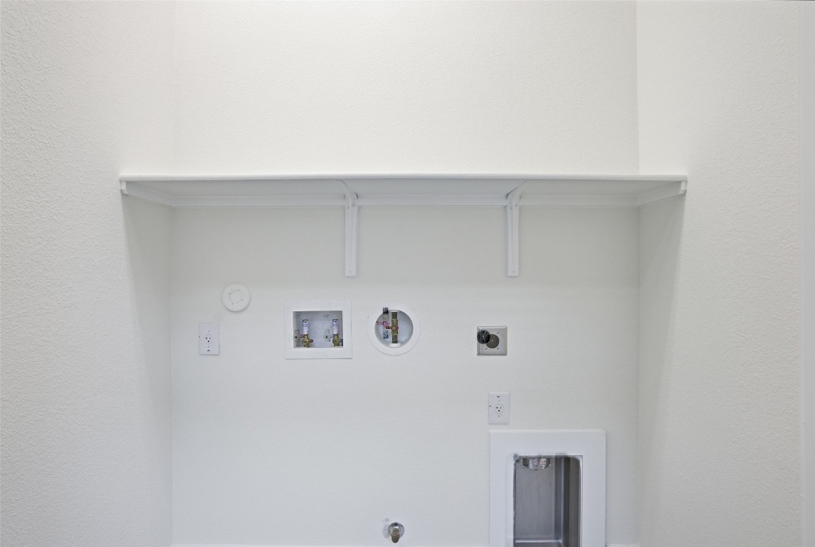 12604 Red Sparrow Street, Unit 14 Austin, TX 78729 - Photo 37 of 40 Laundry room featuring gas dryer hookup, hookup for a washing machine, and electric dryer hookup