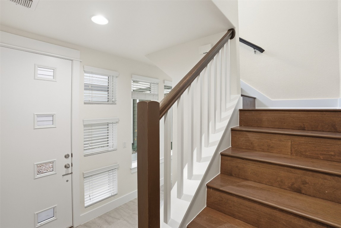 12604 Red Sparrow Street, Unit 14 Austin, TX 78729 - Photo 7 of 40 Entryway with stairs, healthy amount of natural light, and recessed lighting