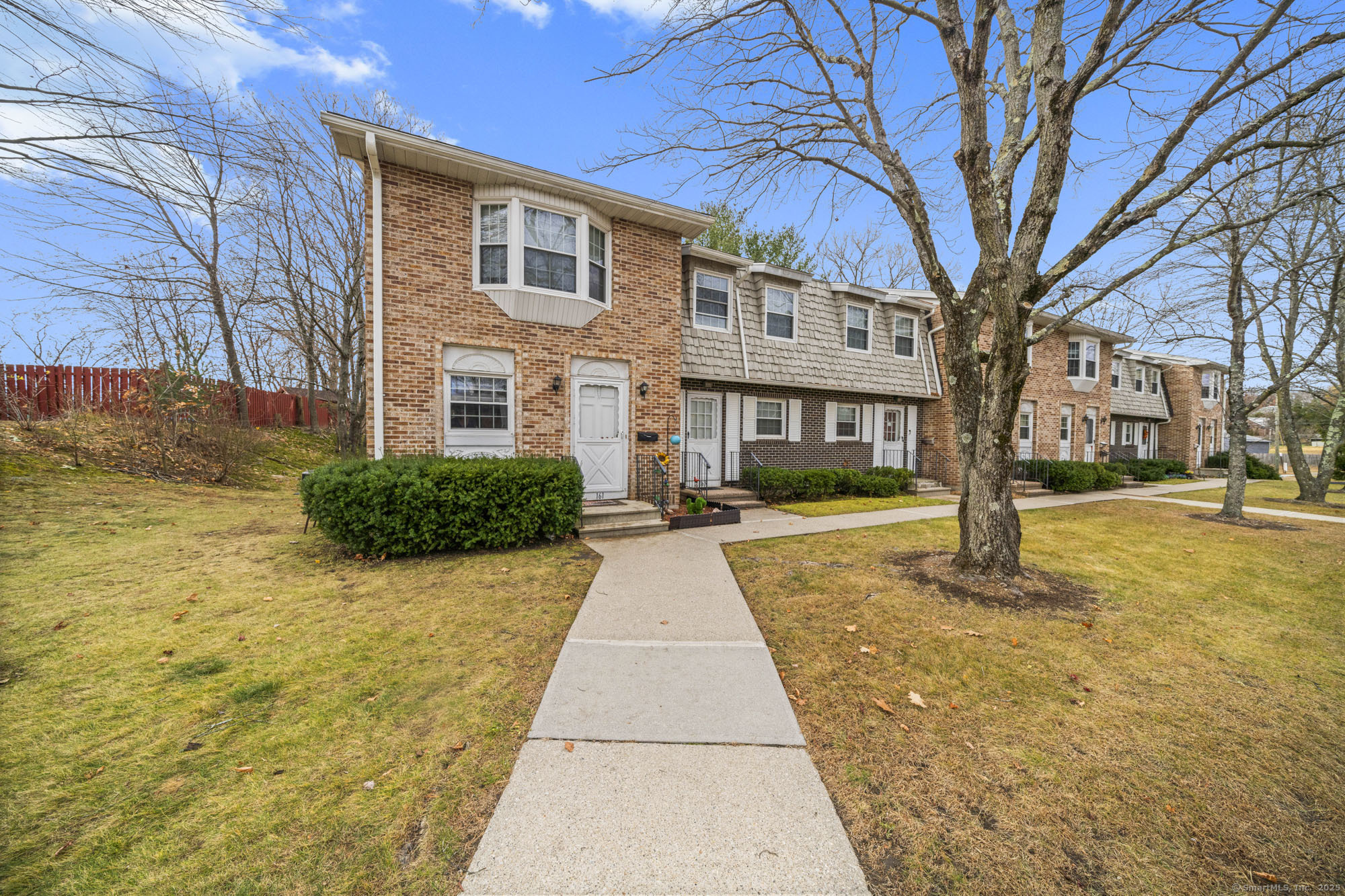 161 Kinney Street Torrington, CT 06790 - Photo 1 of 19 a view of a brick house with a yard