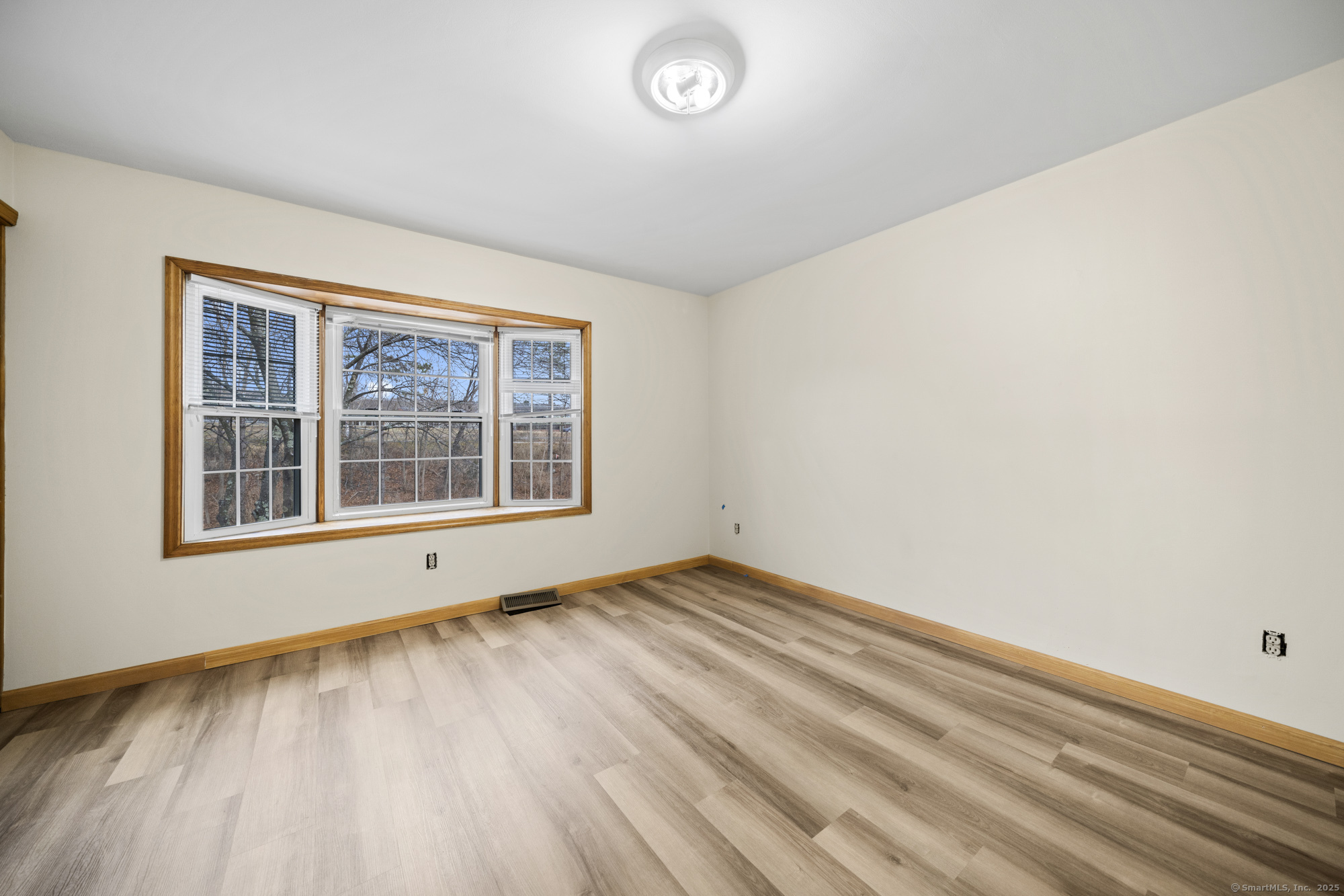 161 Kinney Street Torrington, CT 06790 - Photo 13 of 19 a view of an empty room with a window