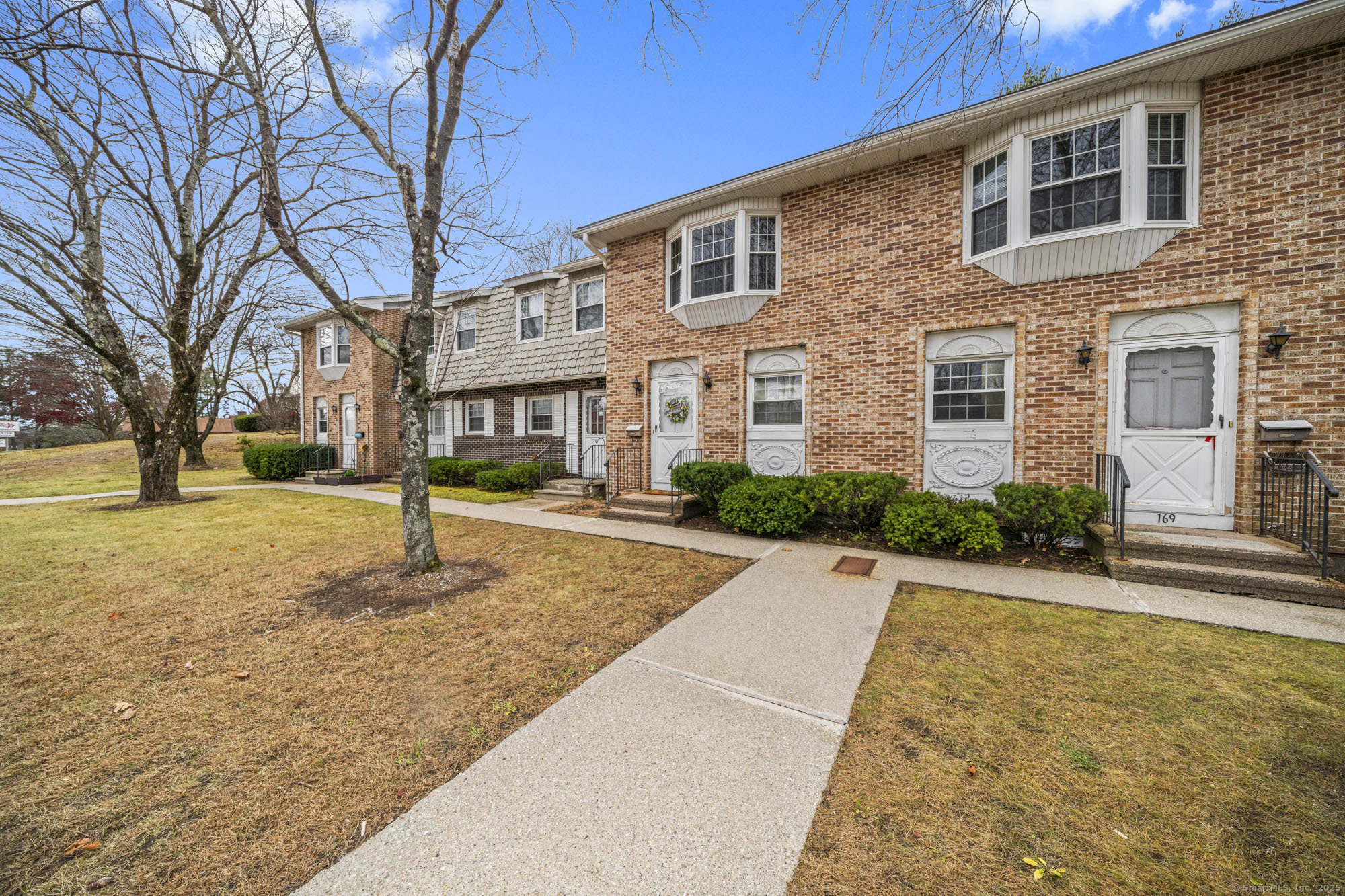161 Kinney Street Torrington, CT 06790 - Photo 2 of 19 a front view of a house with a yard