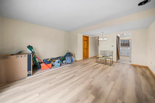 a kitchen with white cabinets and a sink