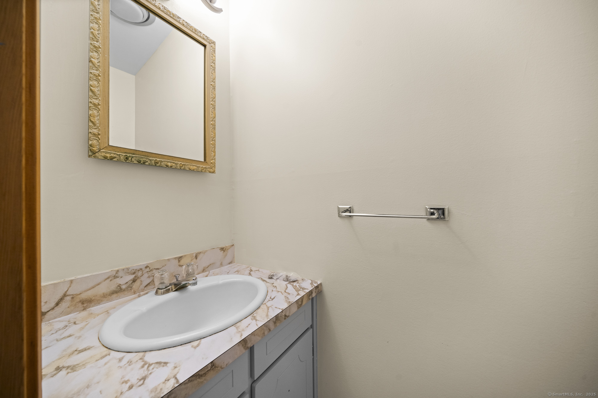 161 Kinney Street Torrington, CT 06790 - Photo 9 of 19 a bathroom with a sink and a mirror