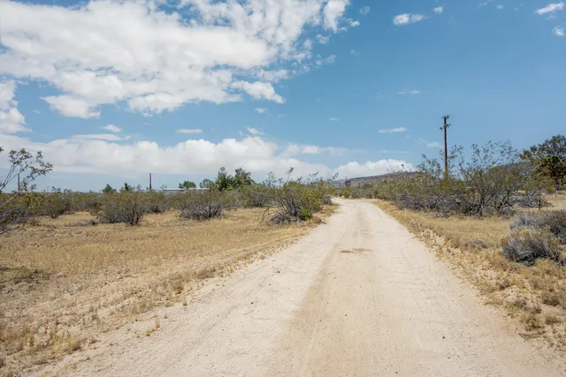 an aerial view of house with yard