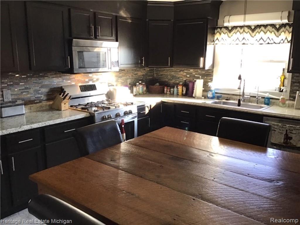 6711 Sharpe Road Fowlerville, MI 48836 - Photo 22 of 47 corner of kitchen.jpeg
