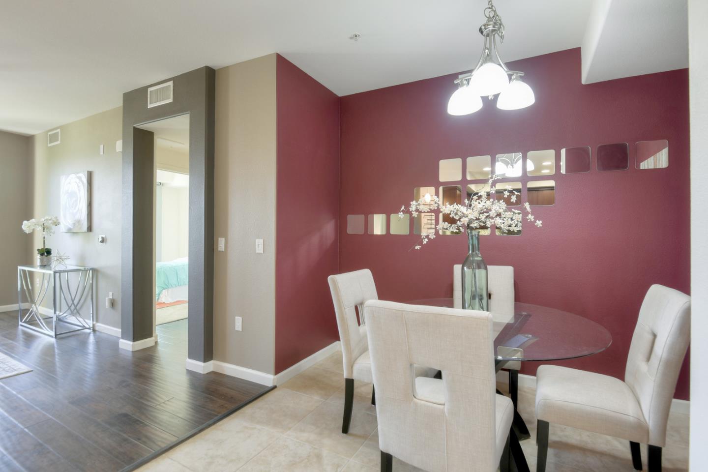1101 South Main Street, Unit 316 Milpitas, CA 95035 - Photo 12 of 30 a view of a dining room with furniture a chandelier and wooden floor