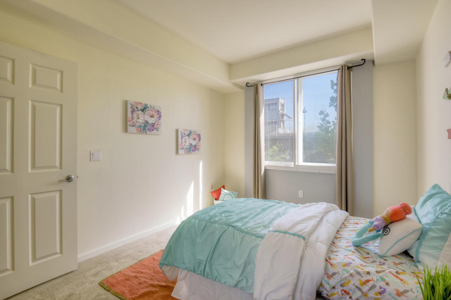 1101 South Main Street, Unit 316 Milpitas, CA 95035 - Photo 14 of 30 a bedroom with a bed and a window