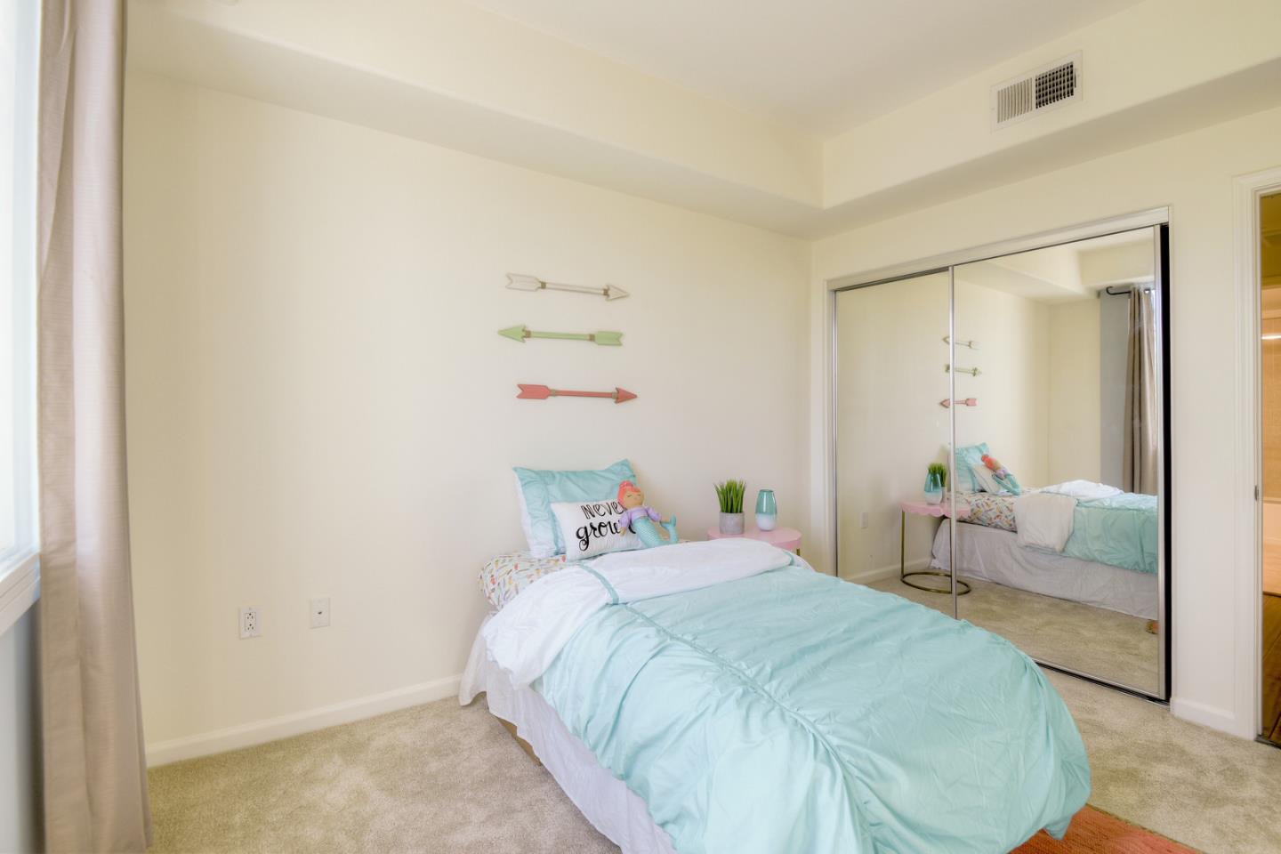 1101 South Main Street, Unit 316 Milpitas, CA 95035 - Photo 15 of 30 a bedroom with a bed and a couch
