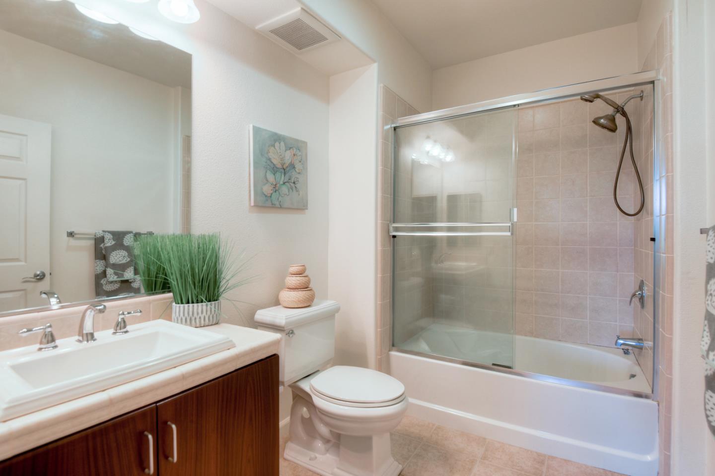 1101 South Main Street, Unit 316 Milpitas, CA 95035 - Photo 17 of 30 a bathroom with a sink toilet and shower