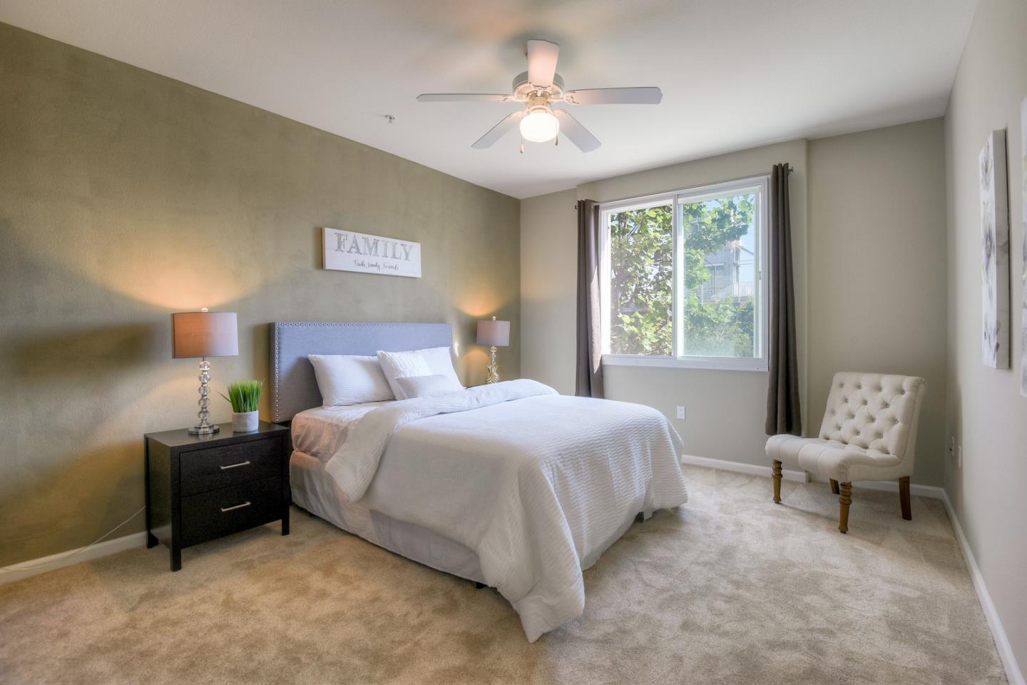 1101 South Main Street, Unit 316 Milpitas, CA 95035 - Photo 18 of 30 a bedroom with a bed and a chandelier