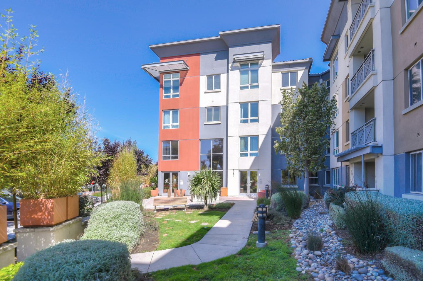 1101 South Main Street, Unit 316 Milpitas, CA 95035 - Photo 27 of 30 a view of a building with a yard