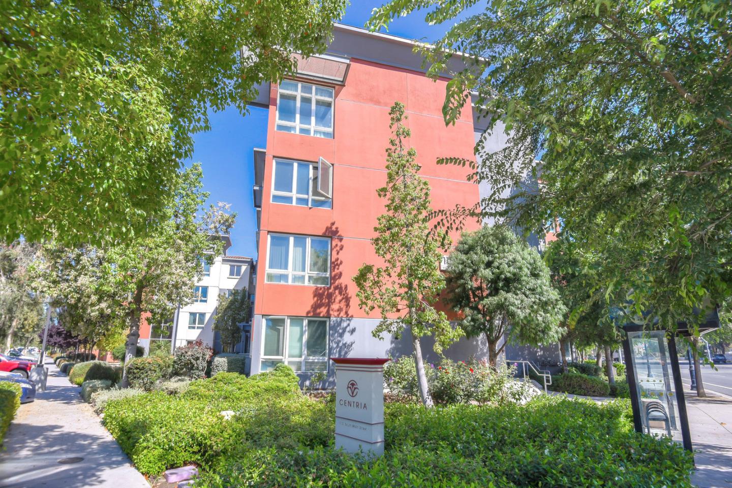 1101 South Main Street, Unit 316 Milpitas, CA 95035 - Photo 28 of 30 front view of a multi story building with a yard