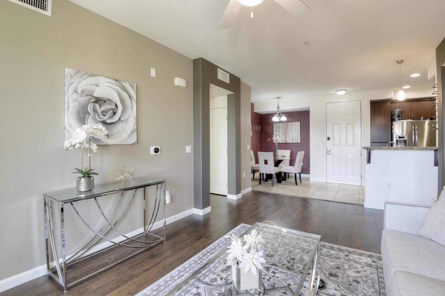 1101 South Main Street, Unit 316 Milpitas, CA 95035 - Photo 4 of 30 a living room with furniture and a table
