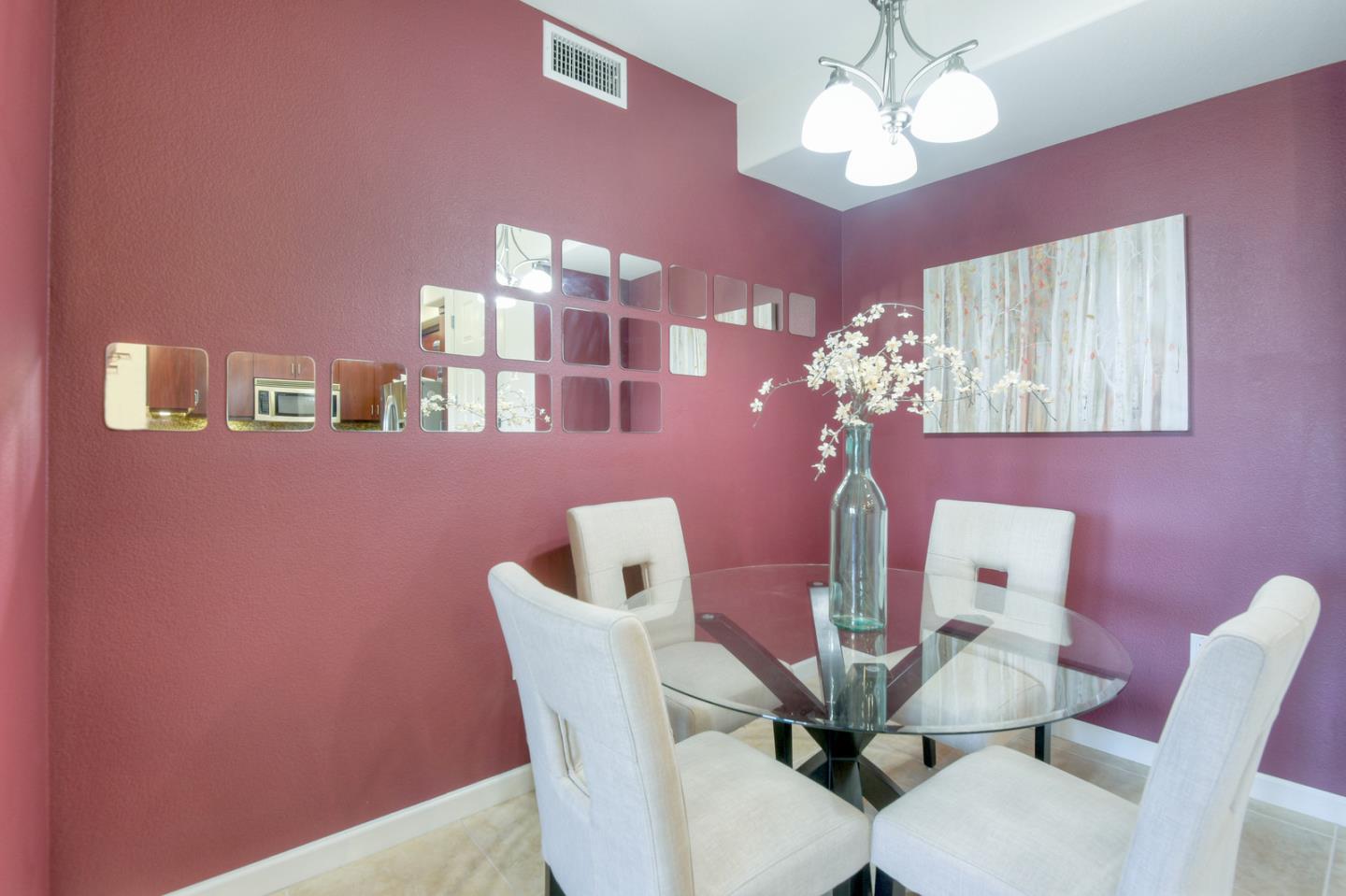 1101 South Main Street, Unit 316 Milpitas, CA 95035 - Photo 10 of 30 a view of a dining room with furniture and chandelier