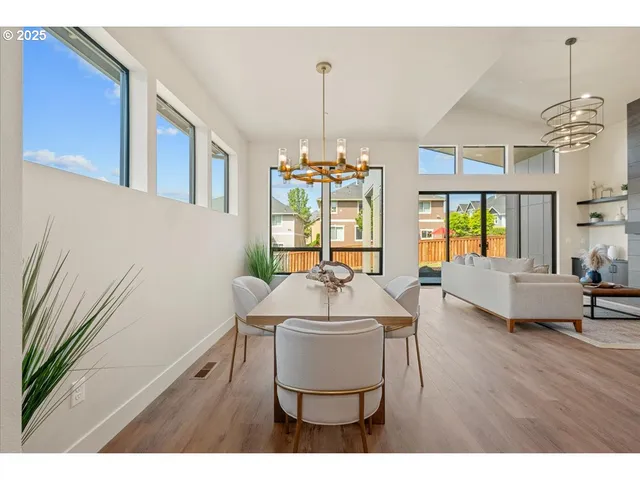 a living room with furniture wooden floor and a window