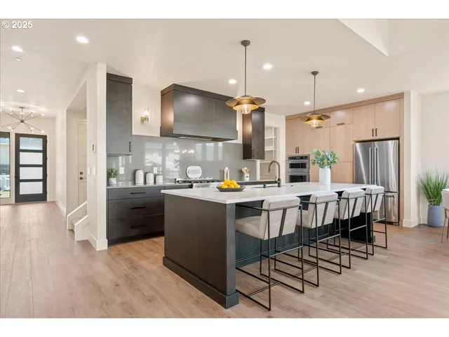 a living room with furniture and kitchen view