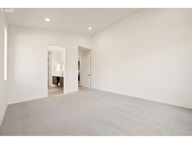 a bathroom with a double vanity sink mirror and shower