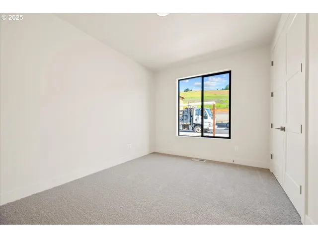 a bathroom with a sink a toilet a mirror and shower