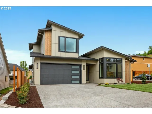 a view of a yard with a house in the background