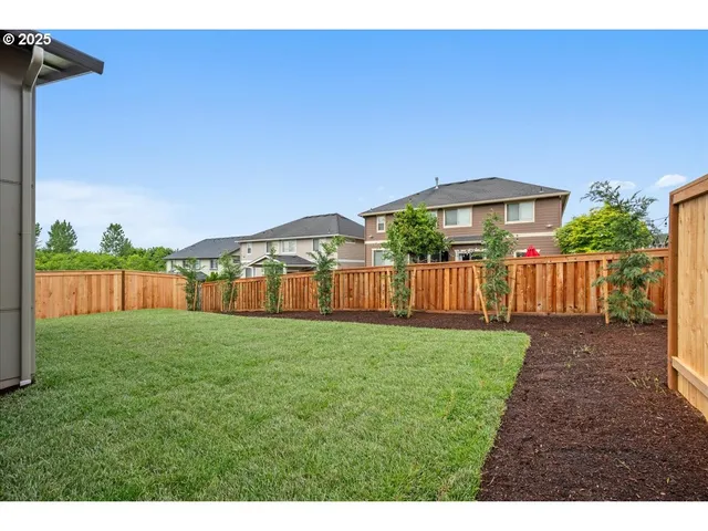 a view of a house with yard and front view of a house