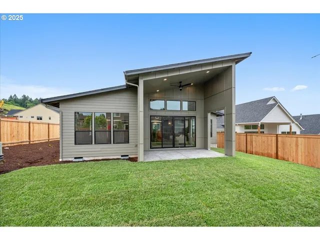 a view of a house with a yard and porch
