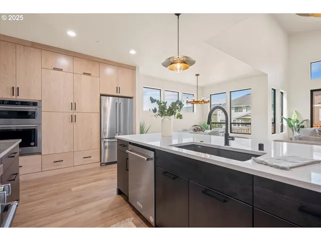 a kitchen with a sink and stove