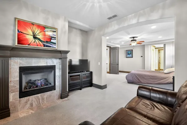 a living room with furniture and a fireplace