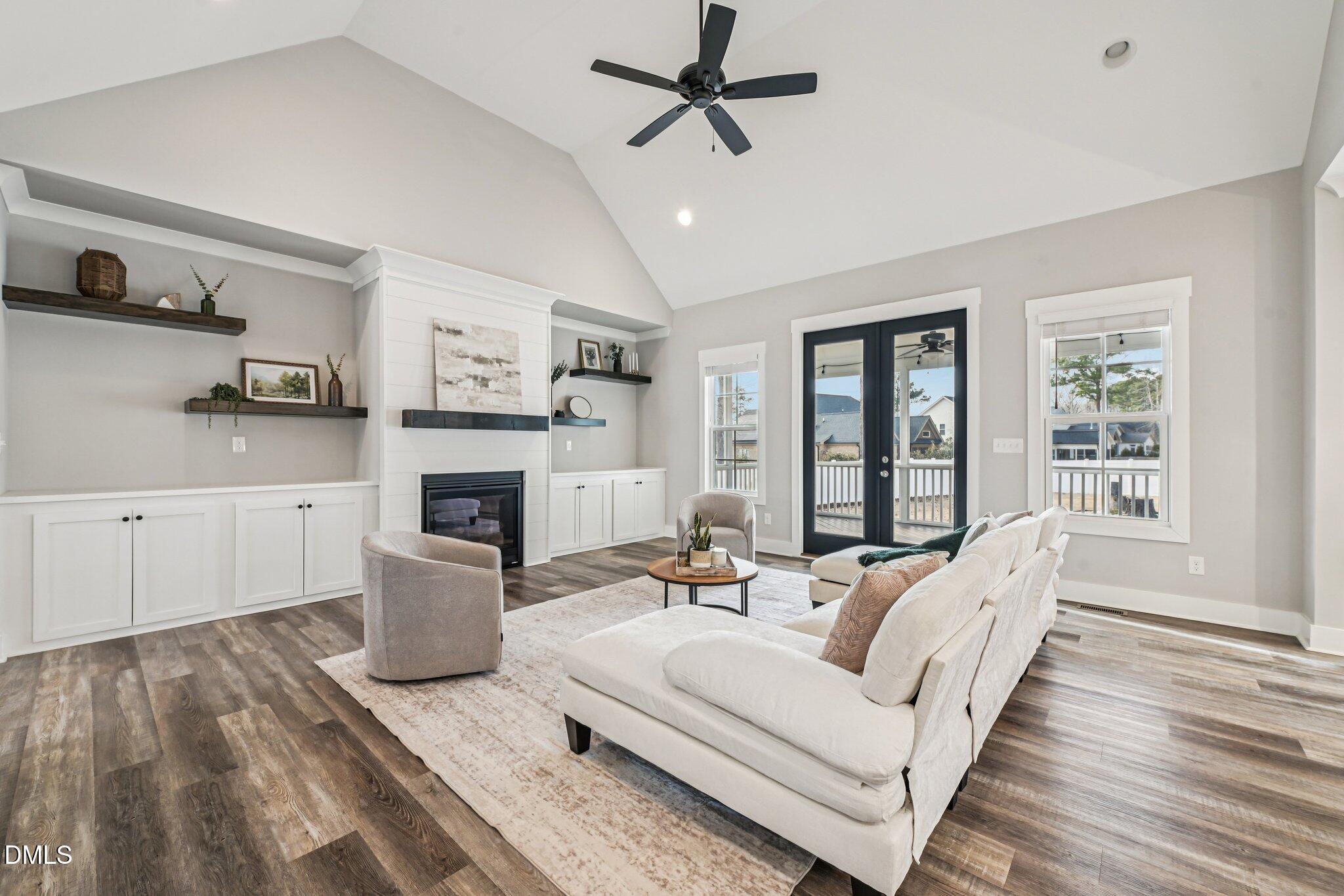 55 Dolores Court Willow Spring, NC 27592 - Photo 8 of 64 a living room with furniture fireplace and window