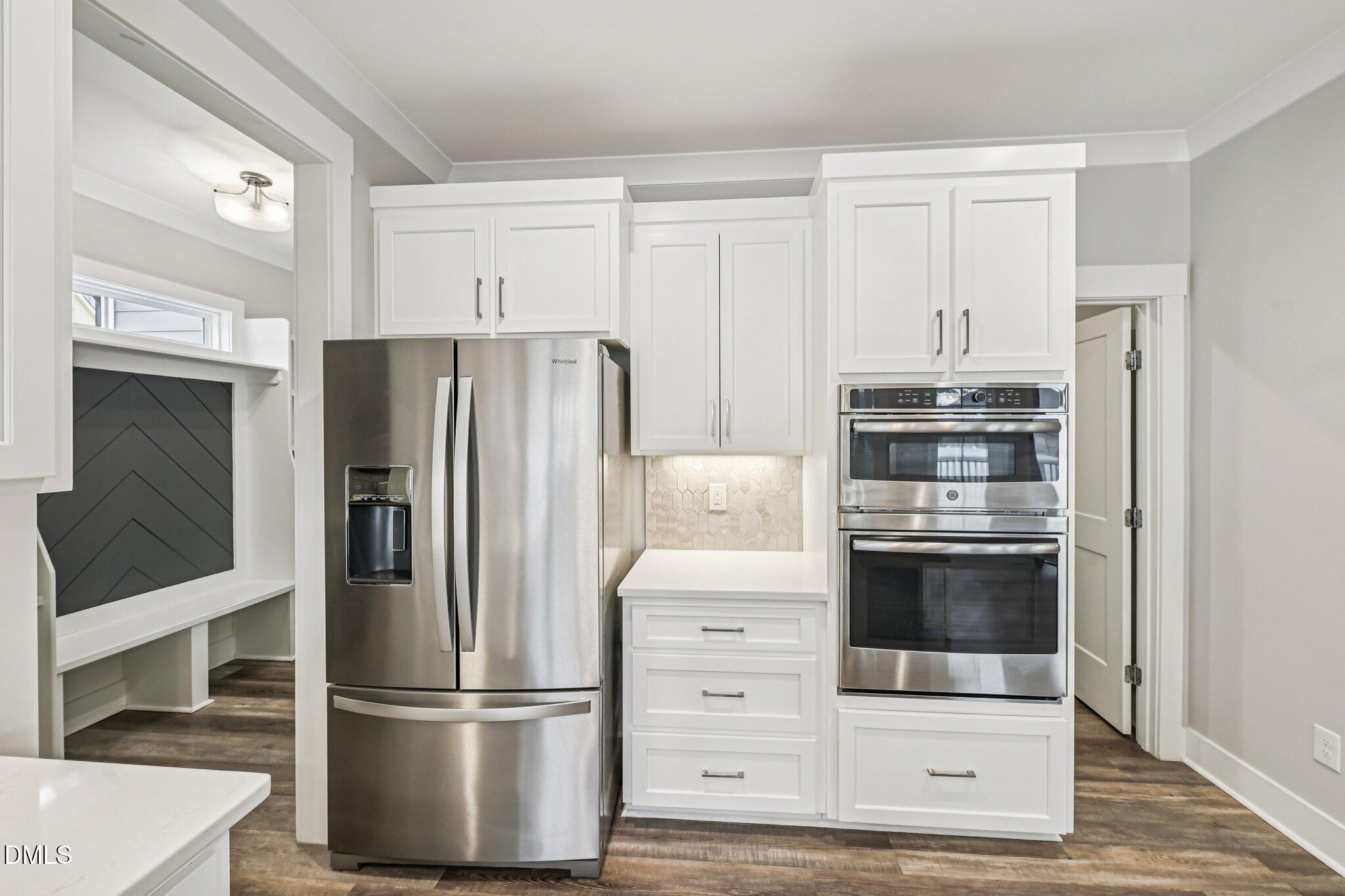 55 Dolores Court Willow Spring, NC 27592 - Photo 16 of 64 a kitchen with stainless steel appliances a refrigerator stove and microwave