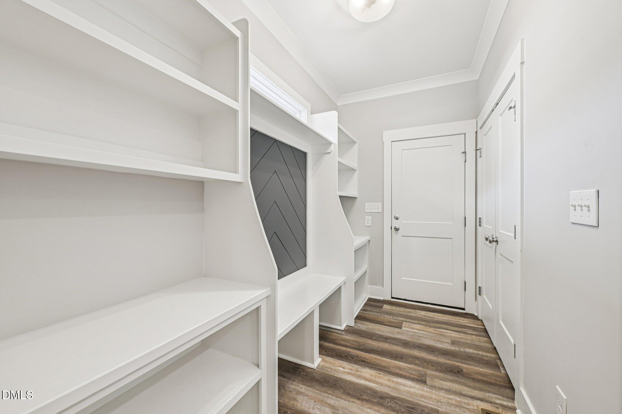 55 Dolores Court Willow Spring, NC 27592 - Photo 20 of 64 a view of an entryway with wooden floor and staircase