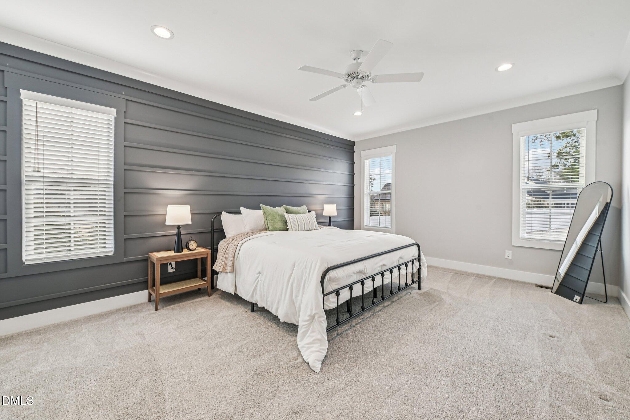 55 Dolores Court Willow Spring, NC 27592 - Photo 23 of 64 a bed sitting in a bedroom next to a window