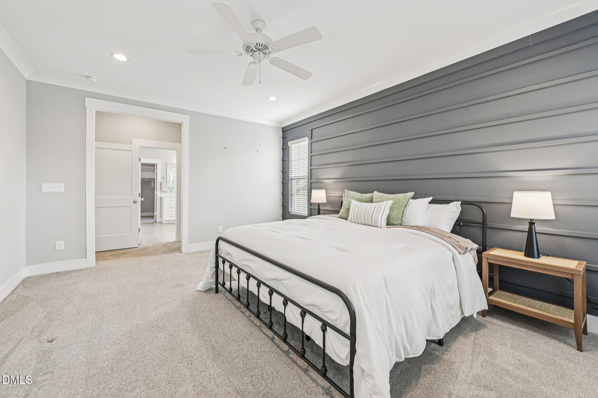 55 Dolores Court Willow Spring, NC 27592 - Photo 24 of 64 a bedroom with a bed and a ceiling fan