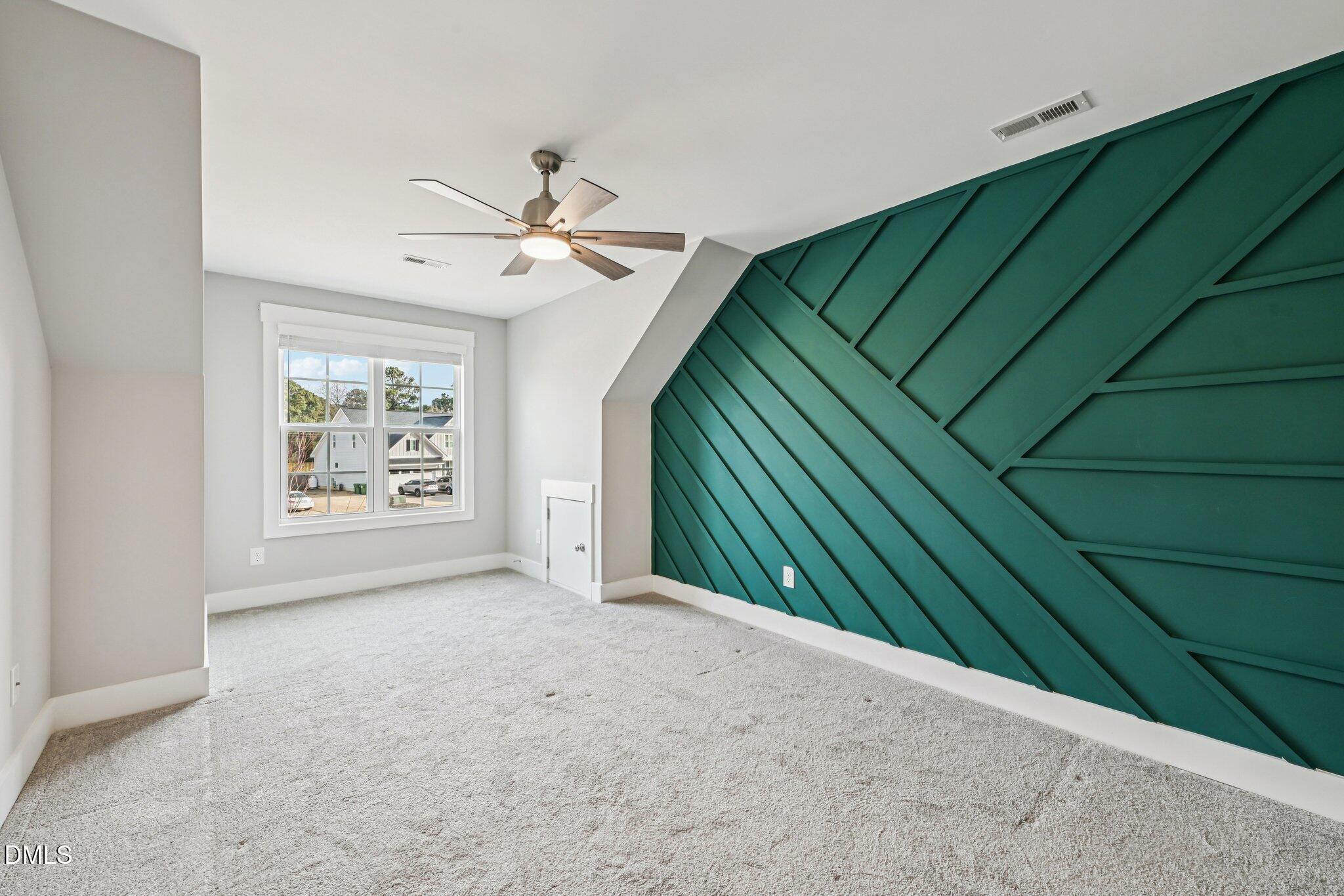 55 Dolores Court Willow Spring, NC 27592 - Photo 33 of 64 a view of a livingroom with a ceiling fan and window