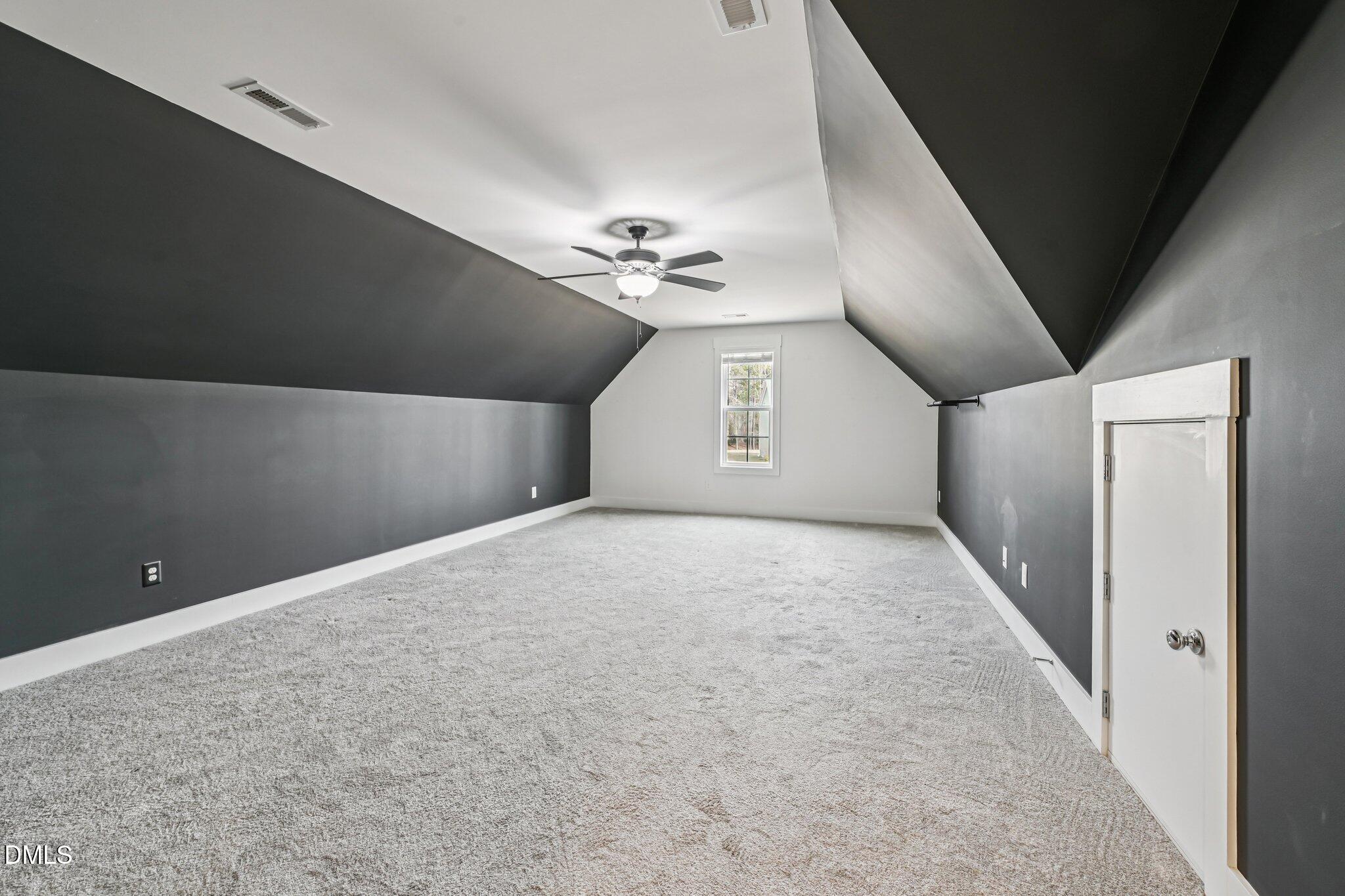 55 Dolores Court Willow Spring, NC 27592 - Photo 35 of 64 en empty room with windows and ceiling fan