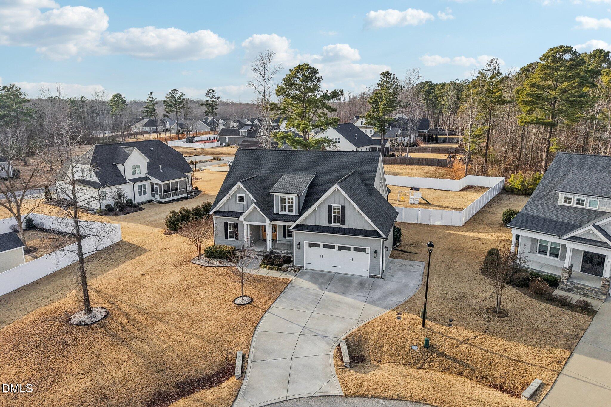 55 Dolores Court Willow Spring, NC 27592 - Photo 49 of 64 a aerial view of a house with a garden