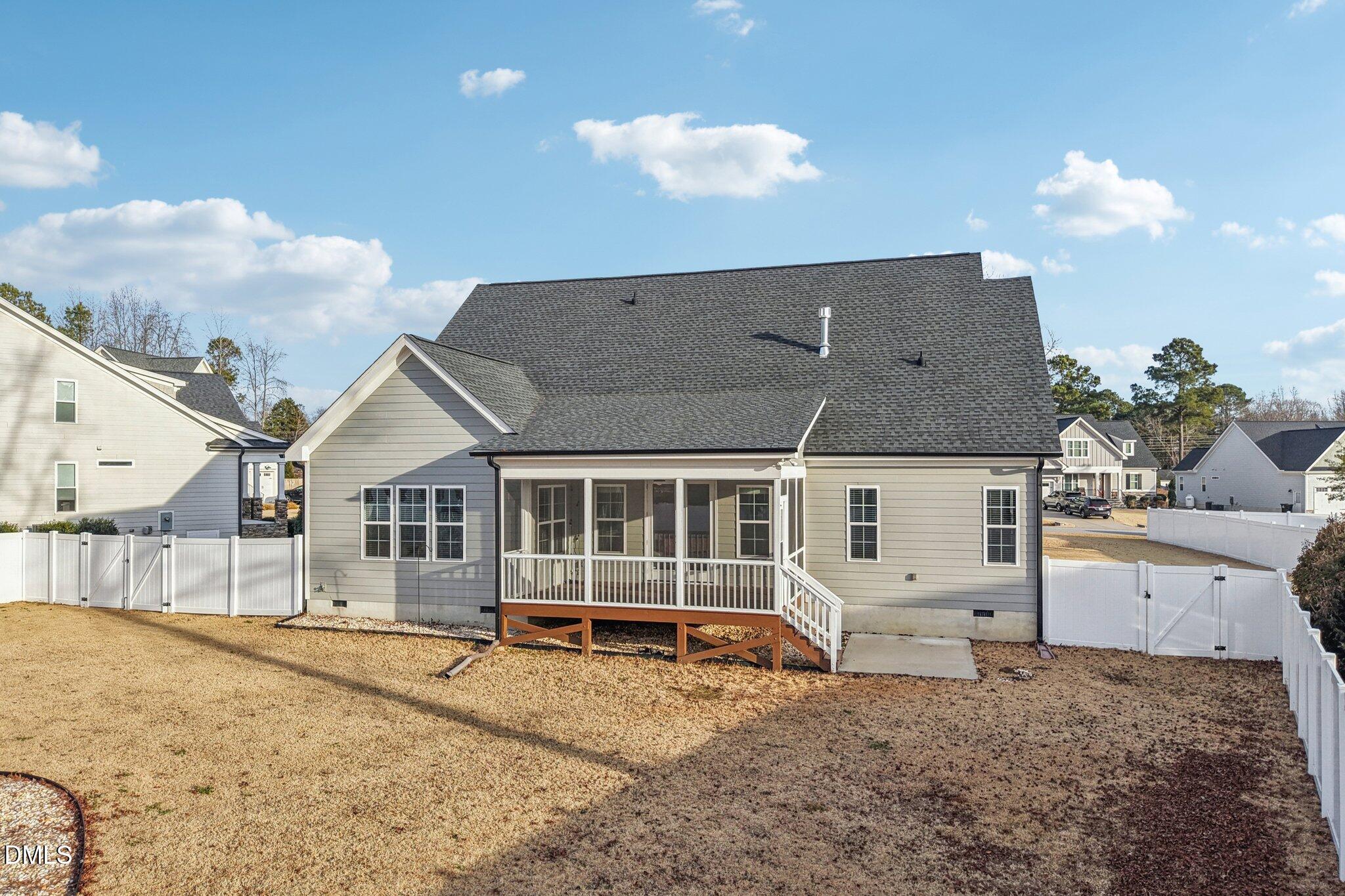 55 Dolores Court Willow Spring, NC 27592 - Photo 58 of 64 a view of a house with a yard and sitting area