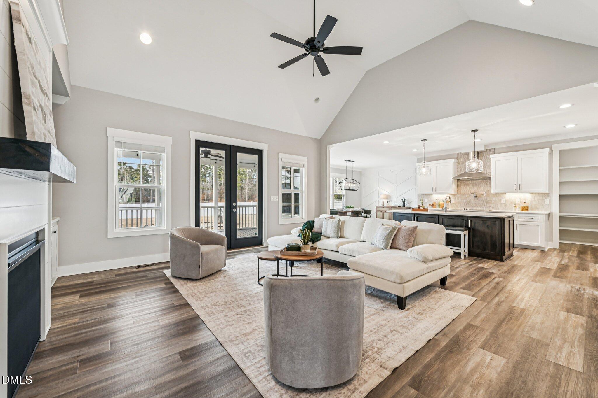55 Dolores Court Willow Spring, NC 27592 - Photo 5 of 64 a living room with fireplace furniture and a wooden floor