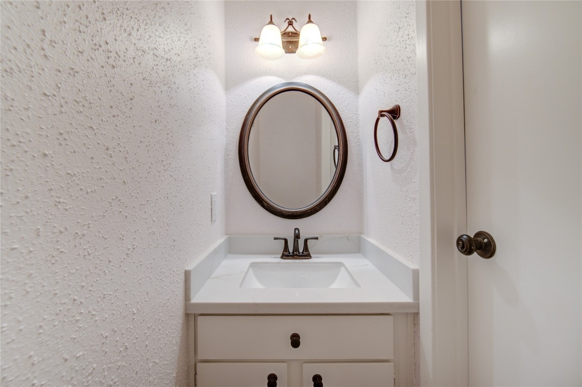 2002 Gentryside Drive, Unit 117 Houston, TX 77077 - Photo 14 of 31 a bathroom with a sink and a mirror