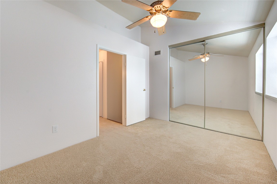 2002 Gentryside Drive, Unit 117 Houston, TX 77077 - Photo 16 of 31 an empty room with a ceiling fan and shower