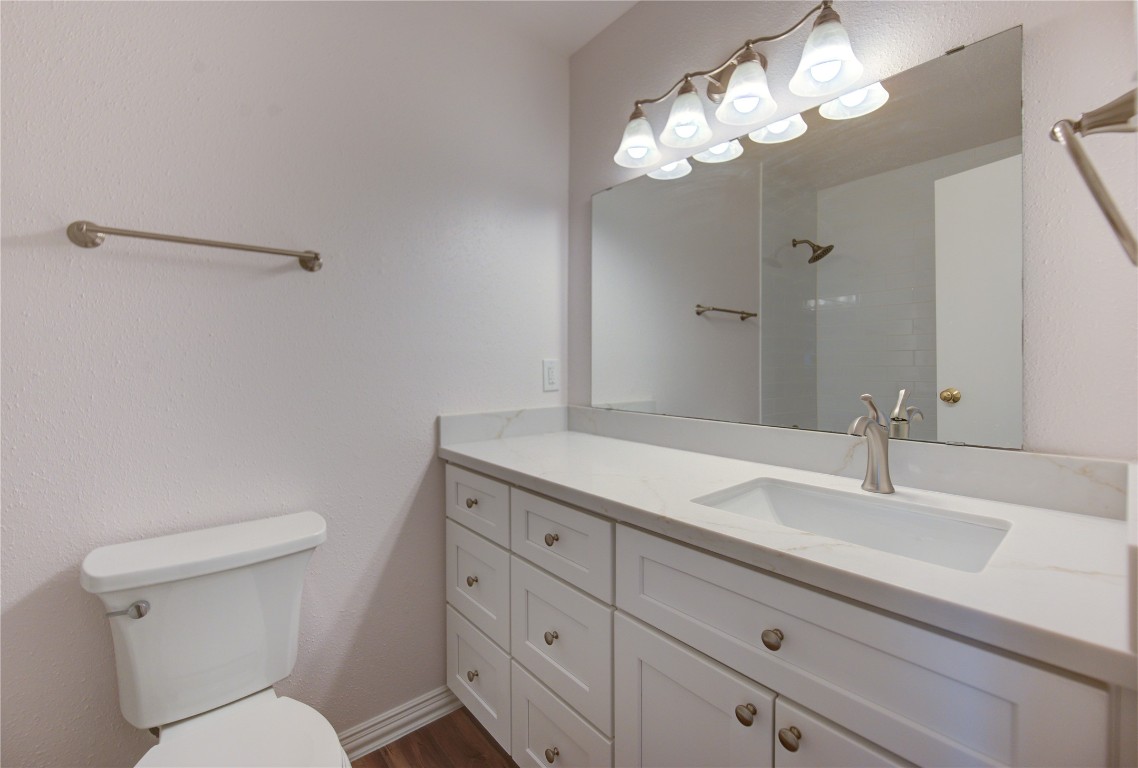 2002 Gentryside Drive, Unit 117 Houston, TX 77077 - Photo 19 of 31 a bathroom with a toilet sink and mirror