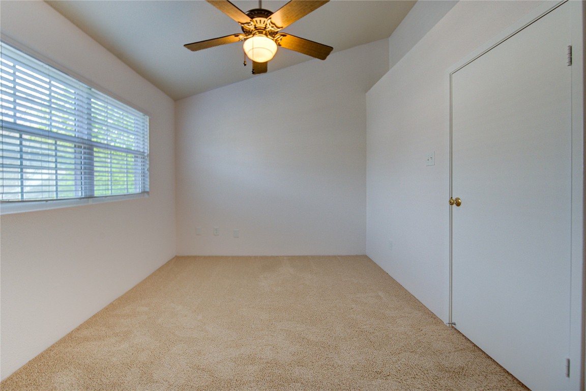 2002 Gentryside Drive, Unit 117 Houston, TX 77077 - Photo 22 of 31 an empty room with windows and fan